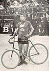 A picture of Louis Darragon beside his bike.