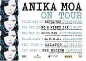 A white poster reading 'Anika Moa on tour', with venues and sponsors below. Four copies of the cover art of Love in Motion are on the left edge of the poster