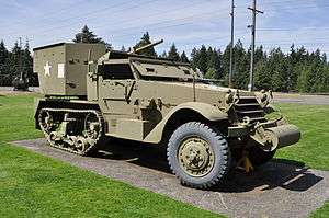 A picture of the M15 Halftrack displayed in a grassy area in Washington State.