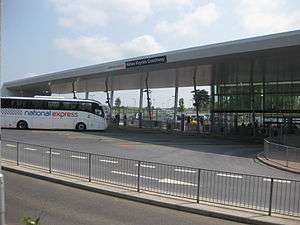 A National Express coach arrives at the Milton Keynes Coachway