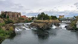 The Spokane River rushes passed Canada Island in Riverfront Park