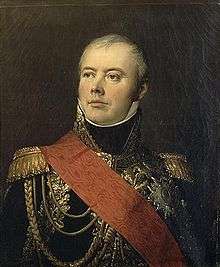 Painting shows a confident-looking man in a dark blue military uniform with lots of gold braid and a red sash across his shoulder.