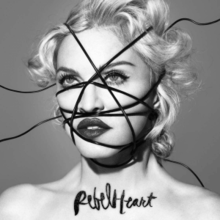Black-and-white image of Madonna, with black strings going criss-cross over her face