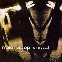 A blurred mirror-image of a woman walking down a dark, backlit hallway with her hand touching the wall. The words "magnapop {lay it down}" are written in white across the middle.
