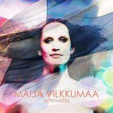 Image of a thirty-something woman, with free, black, apparently tangled hair. The Finnish flag is translucently placed in front of her, allowing her face to be shown clearly through the flag. On the image capital script it reads "Maija Vilkkumaa" on the upper row and "lottovoitto" on the lower row.