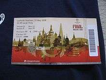 A ticket with a barcode strip on the right. The ticket is white on top half and red on the bottom, separated by images of the Moscow skyline in gold. In the top left corner is the seat information and the top right has the UEFA Champions League logo and the words "Final Moscow 2008".
