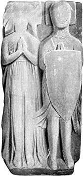 Black and white illustration of the effigy of armed knight and his wife