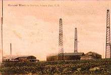 An old sepia postcard of the radio towers at the Marconi Wireless Station