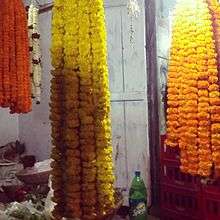 hanging garlands made of Marigold offered to the central deity