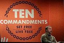 Mark Driscoll preaching at Mars Hill Church, set against a large projected image that reads "Ten Commandments: set free to live free"