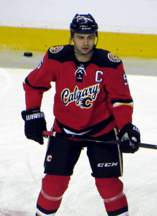 Giordano observes his teammates (off-camera) during a pre-game warm up.