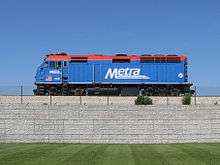 Blue locomotive on raised track
