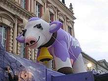 Large, inflated, purple Milka cow