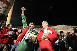 Luis Urzúa, the leader of the trapped miners and the last of the 33 to be lifted to freedom, celebrates with President Piñera at San José Mine, during "Operación San Lorenzo".