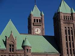 Four of city hall's turrets seen near the roof