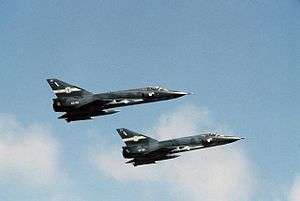 Side view of two delta-wing jet fighters in flight