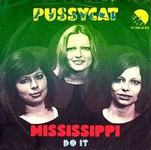 Black and white photograph of the members of Pussycat band with blue border on top and below