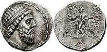 Two sides of a coin. The side on the left showing the head of a bearded man, while the right a standing individual.