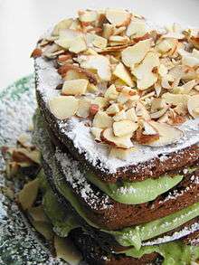 A mocha almond fudge avocado layer cake. Avocado is present within the layers of the cake.