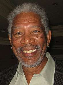 Morgan Freeman headshot facing the camera and smiling