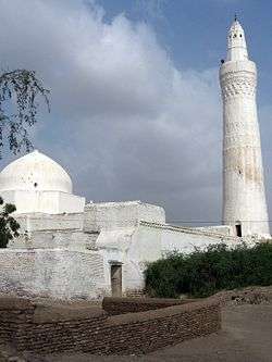 White minaret and mosque.