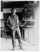 full length portrait of N.C. with his palette in his studio