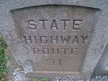 A stamp on a bridge support reading State Highway Route 31