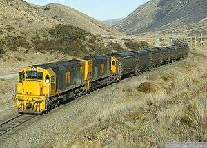 Two DX class U26Cs in New Zealand with a coal train.