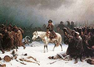 Man on a white horse surrounded by hunched over troops marching through the snow. Dead bodies and broken wagons litter the ground.
