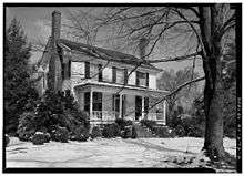 A black and white photograph of a two-story colonial home formerly belonging to Francis Nash and, after Nash's death, to William Hooper