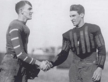 Two football players, shaking hands