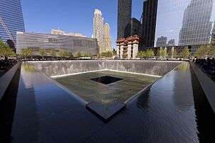 The National September 11 Memorial's South Pool is a black square-shaped fountain, lower than the surrounding plaza.