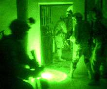 Paratroopers in Fallujah, Iraq conduct a night raid using Night Vision Goggles