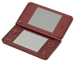 An opened clamshell dual-screen handheld device. A camera is embedded in the internal hinge.