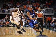 Duke Blue Devils guard Nolan Smith (2) drive past Miami Hurricanes guard Durand Scott (1) during the game between Miami and Duke at Bank United Center in Coral Gables, Florida.