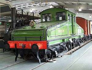 Old green electric locomotive in a museum