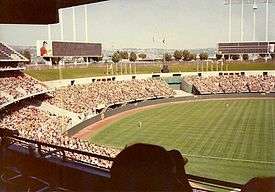 A photograph of the outfield at a baseball game shot from the upper deck