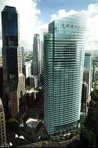 Artist's image of a complete skyscraper; the building is portrayed with a slightly curved glass facade with an angled roofline.