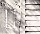precision graphite drawing of close-up of old door and clapboard surrounding, child height, with lights and shadows of winter playing on them