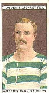 A colour drawing of a moustached man wearing a green and white striped shirt.