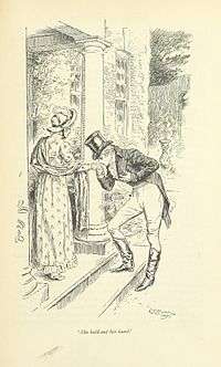 On a stoop, a young man kisses a young woman's hand.