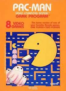 Artwork of an orange, vertical rectangular box. The top third reads "Pac-Man Video Computer System Game Program". Below that reads "8 Video Games" and "The home version of one of your favorite Arcade games. One Player • Two Players". The lower two-thirds depicts a yellow circular character with his mouth open, eating a white wafer against the backdrop of a blue maze with orange walls. In the lower left corner of the maze are three pink ghosts, each with two white eyes.