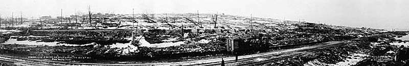 Panoramic view over traintracks to destroyed cityscape