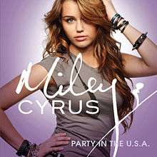A teenage girl with long, curly brunette hair and a gray T-shirt faces the font as she touches her head with her right hand and waist with her left. Letters in the center of the image overlapping the girl's chest spell "Miley Cyrus" in cursive while "Party in the U.S.A." is spelled in print in the bottom right corner. The image has a lavender background.