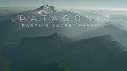 Series title over an aerial view of Patogonian mountains