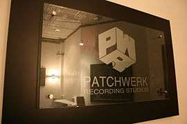 A picture of the Patchwerk sign hanging in the entrance of the studios.