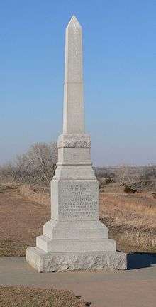 Square granite obelisk, 10–12 feet high
