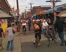 View of pedestrians and cyclists in Kensington Market