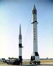 Pershing missile next to Redstone missile illustrating difference in height and range