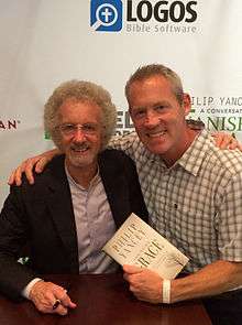 Philip Yancey at a book signing with a fan in 2014